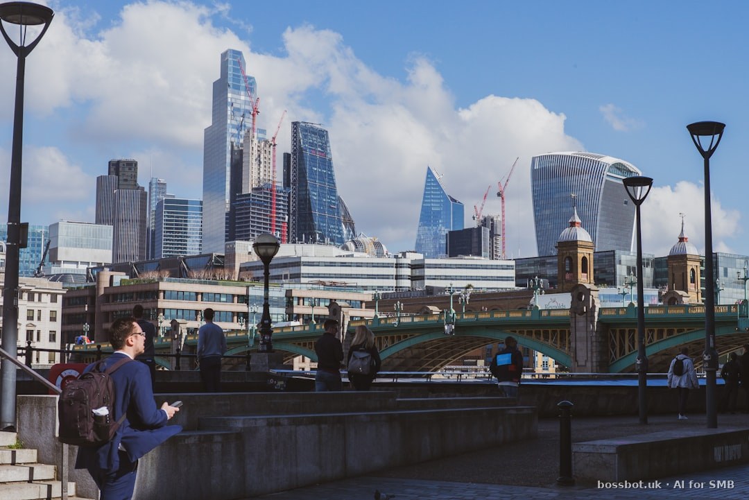 A woman standing on a bridge looking at her cell phone