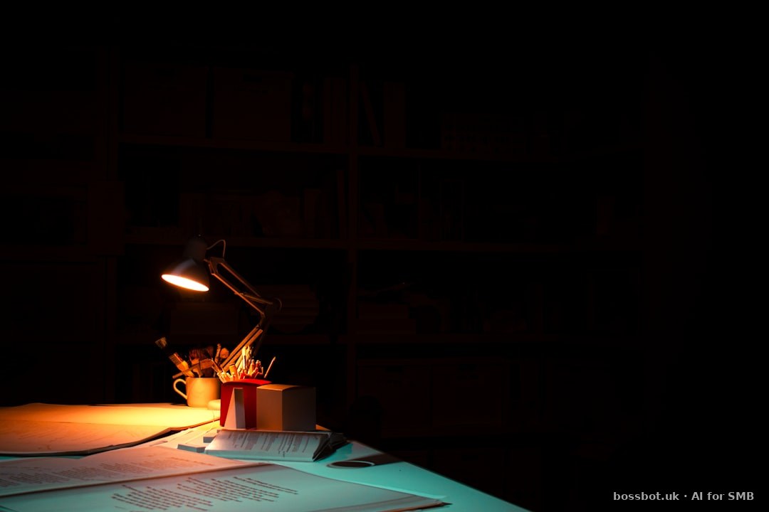 A table with a lit candle on top of it