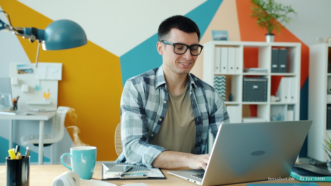 Man working on a laptop in a colorful office.