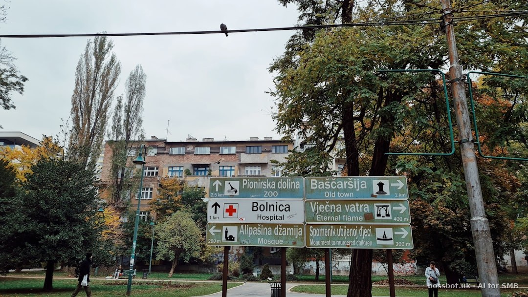 A street sign in front of a large building