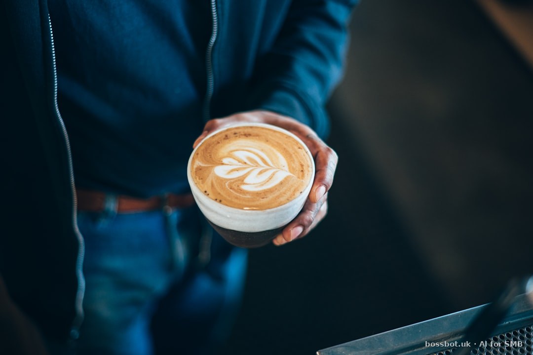 A person holding a cup of coffee in their hand
