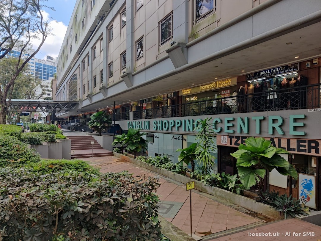 A building that has a lot of plants in front of it