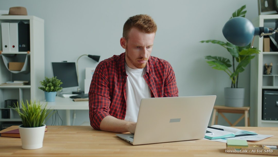 Nigerian entrepreneur in Lagos evaluating multi-channel messaging platform tiers on laptop