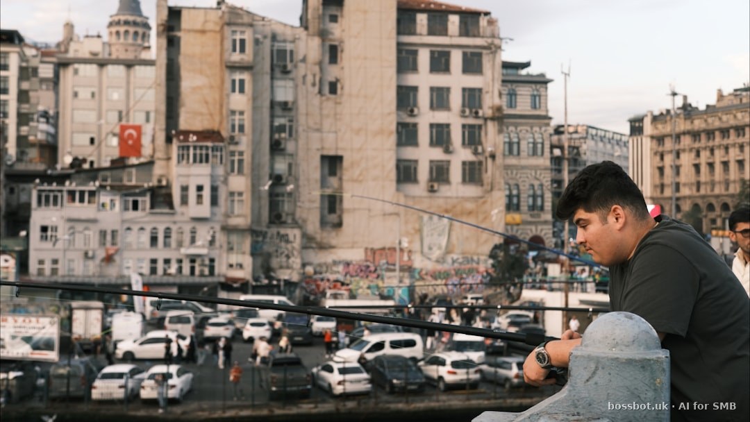 Man fishing with city buildings and traffic in background