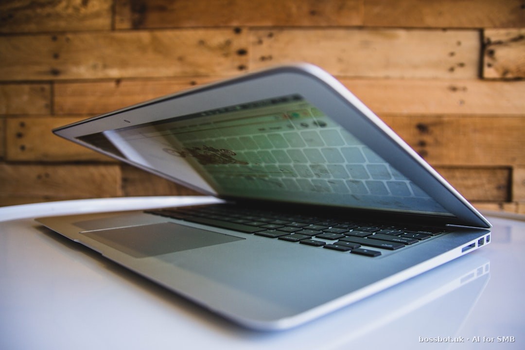 Accountant reviewing WhatsApp chatbot client query responses on laptop — AI automation for accounting practice client communication