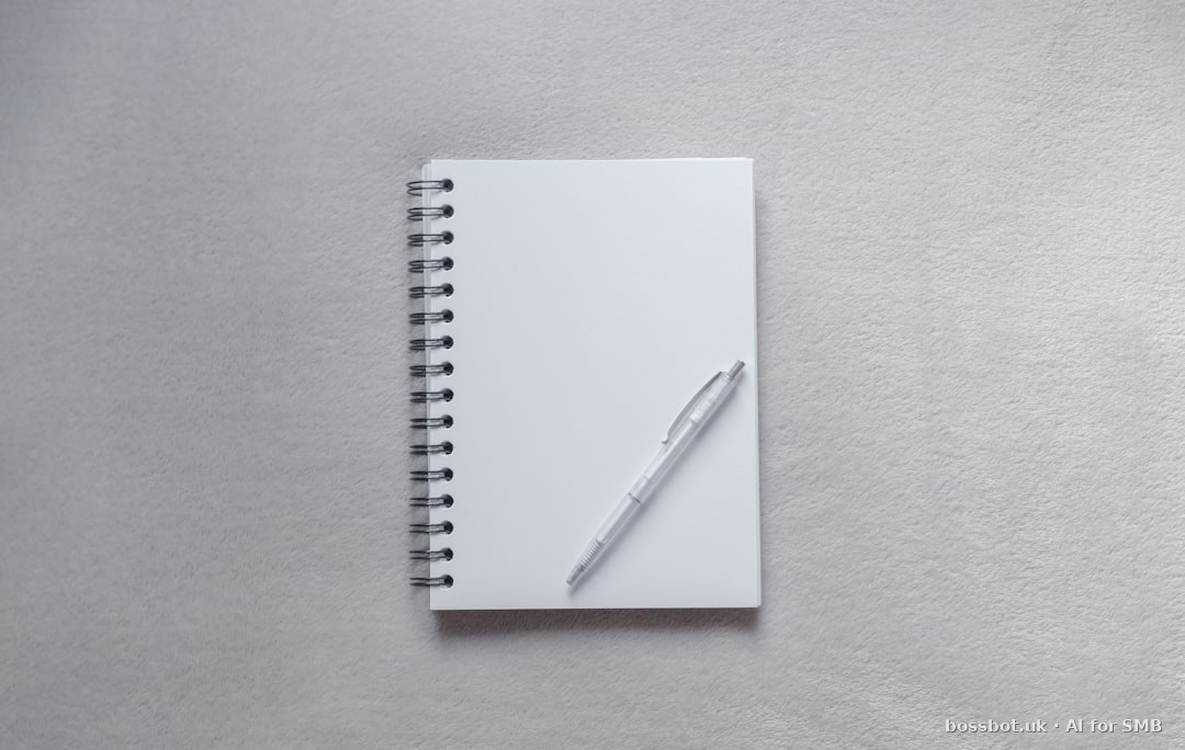 White notebook with pen on top