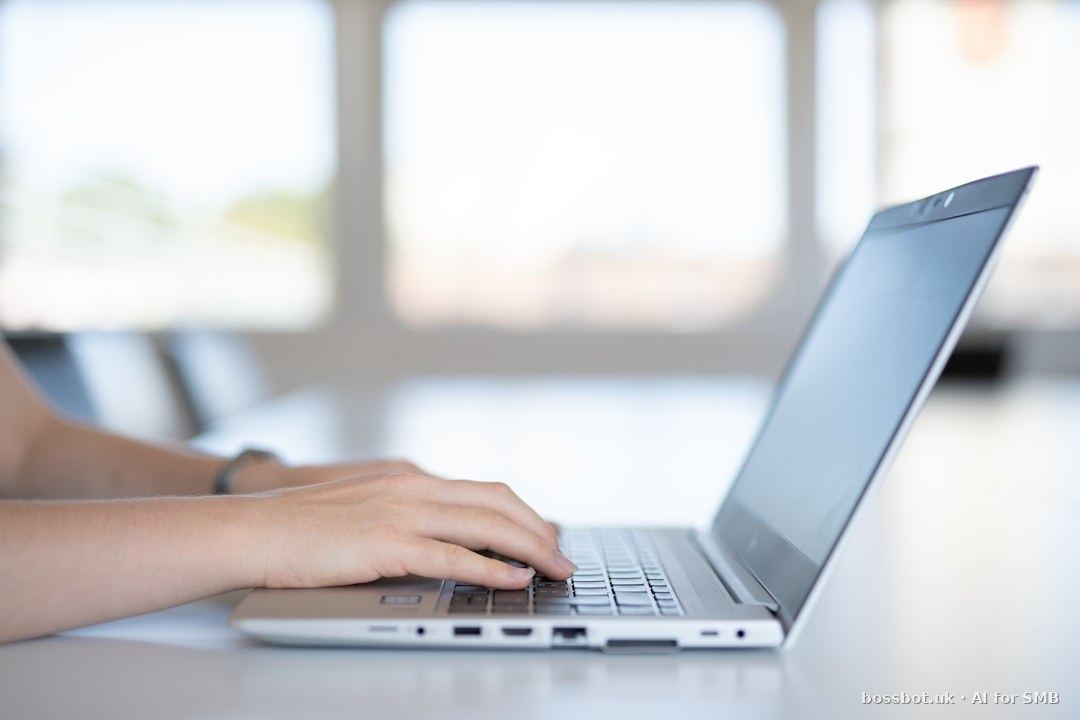 A close up of a person typing on a laptop