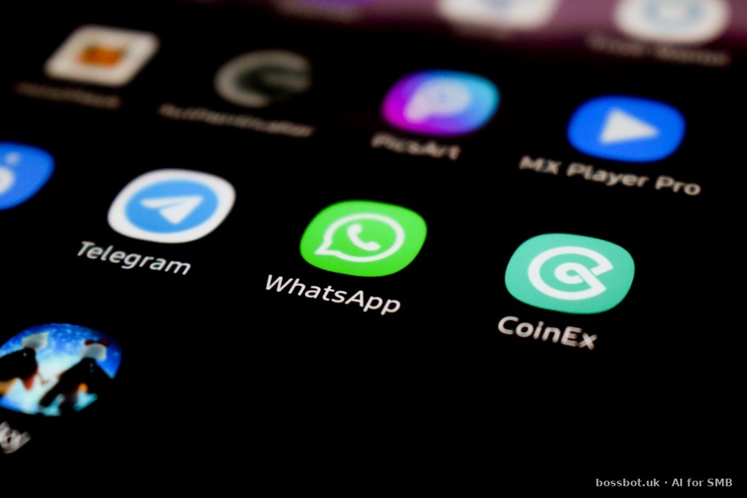 A close up of a cell phone with whatsapp on the screen